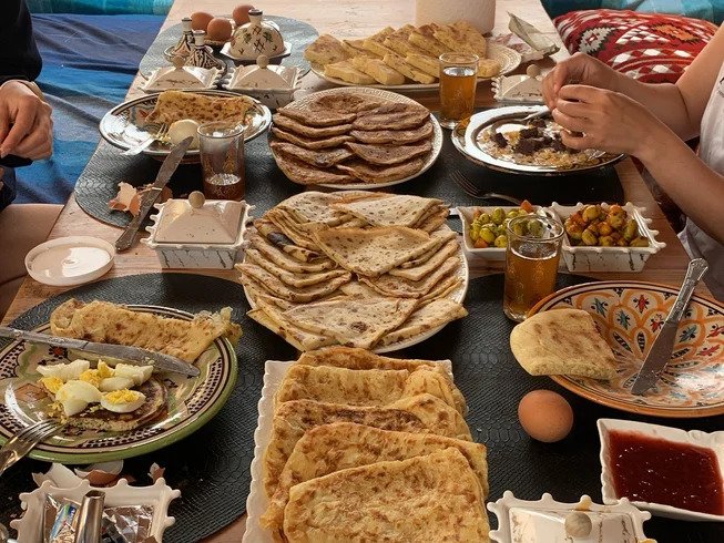 Let Us Surf Camp family style dinner with traditional Moroccan tagine