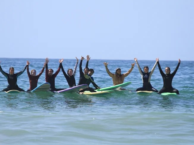 Maona Surf Camp yoga retreat with ocean view and palm trees