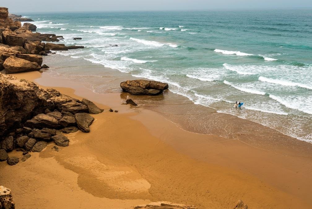 Wide ocean view with surfboard on Tamraght beach
