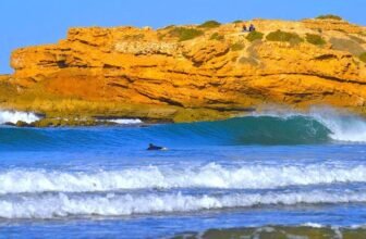 Tamraght vs Taghazout surf camps in Morocco with surfers enjoying Atlantic coast waves