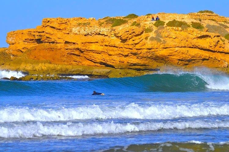 Tamraght vs Taghazout surf camps in Morocco with surfers enjoying Atlantic coast waves